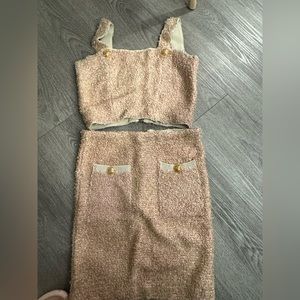 Suit. Pink short skirt.